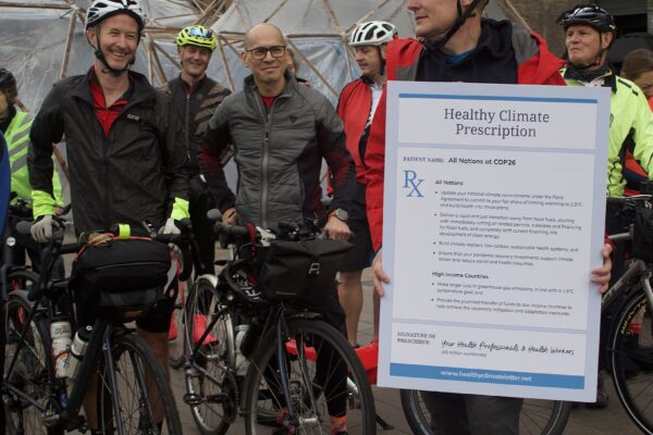Ewan poses with the Healthy Climate Prescription Letter