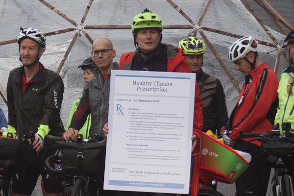 Mat and other riders pictured with the Healthy Climate Prescription Letter