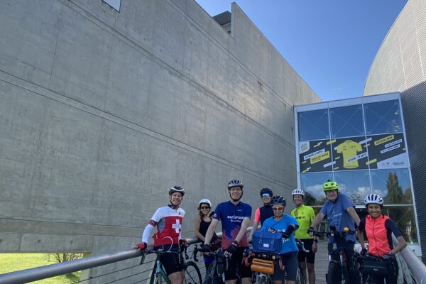 Riders in front of the International Union of Cyclists HQ in Aigle